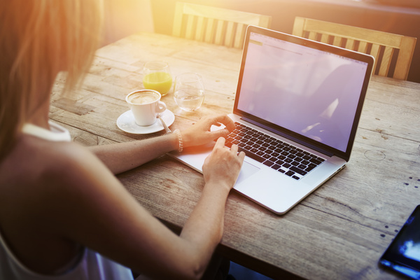 Coffee-on-the-desktop-with-people-using-the-computer-Stock-Photo-05